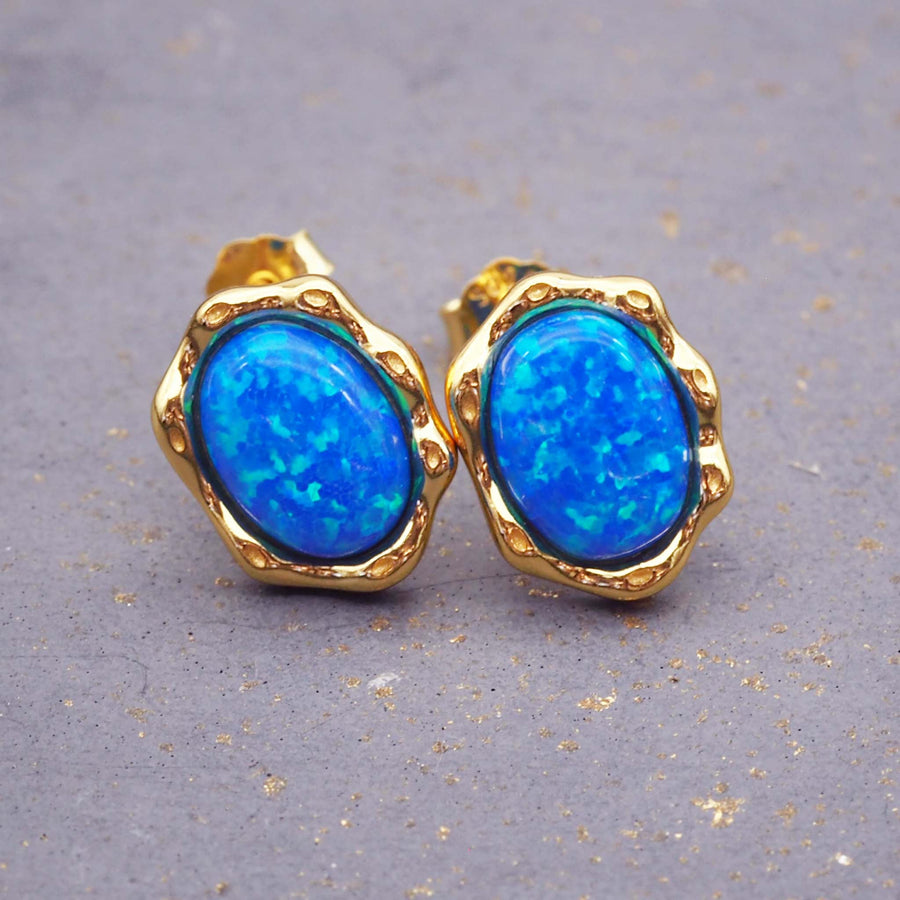 gold plating over sterling silver earrings made with beautiful blue synthetic opals - women's jewellery online by indie and harper