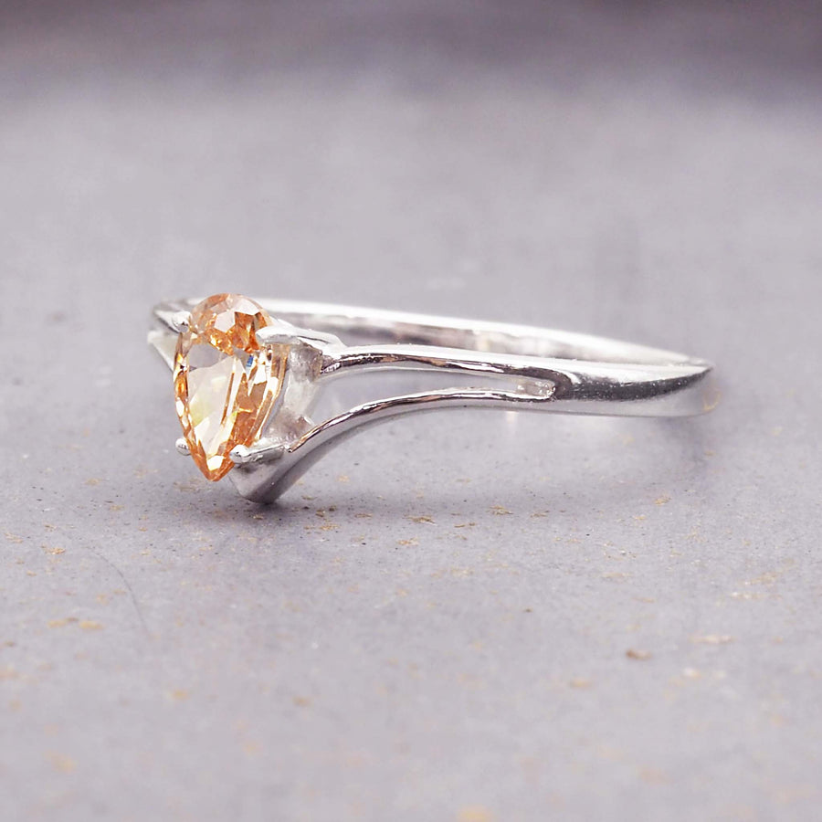 raindrop chevron ring - dainty peach coloured cubic zirconia gemstone in a classic chevron design - sterling silver jewellery by online jewellery brand indie and harper