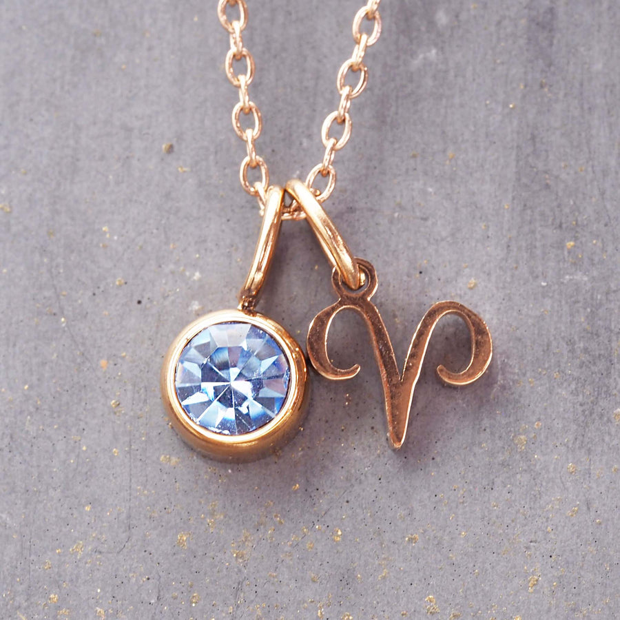 rose gold march aries necklace - zodiac jewellery for women made with stainless stee, rose gold plating and a blue cubic zirconia - women's jewellery online by indie and harper