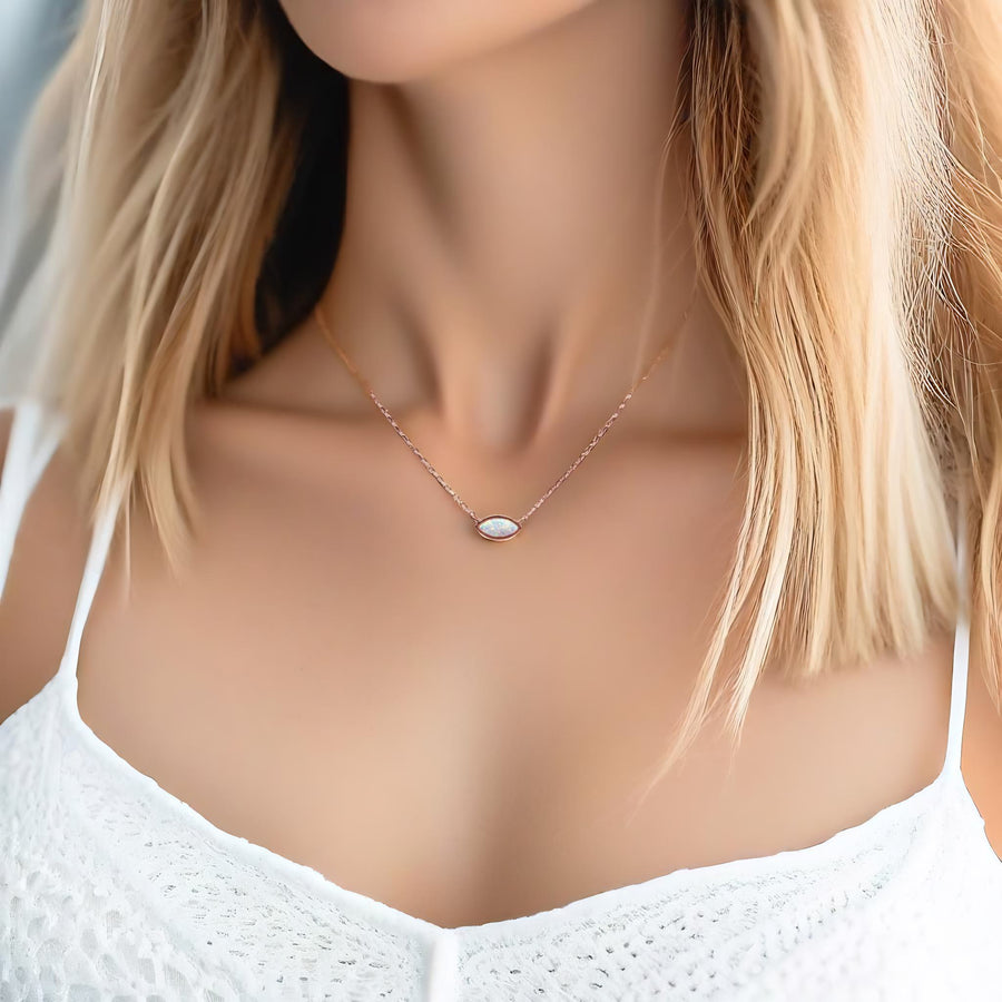 Woman wearing dainty rose gold necklace - opal jewellery by australian jewellery brands indie and harper