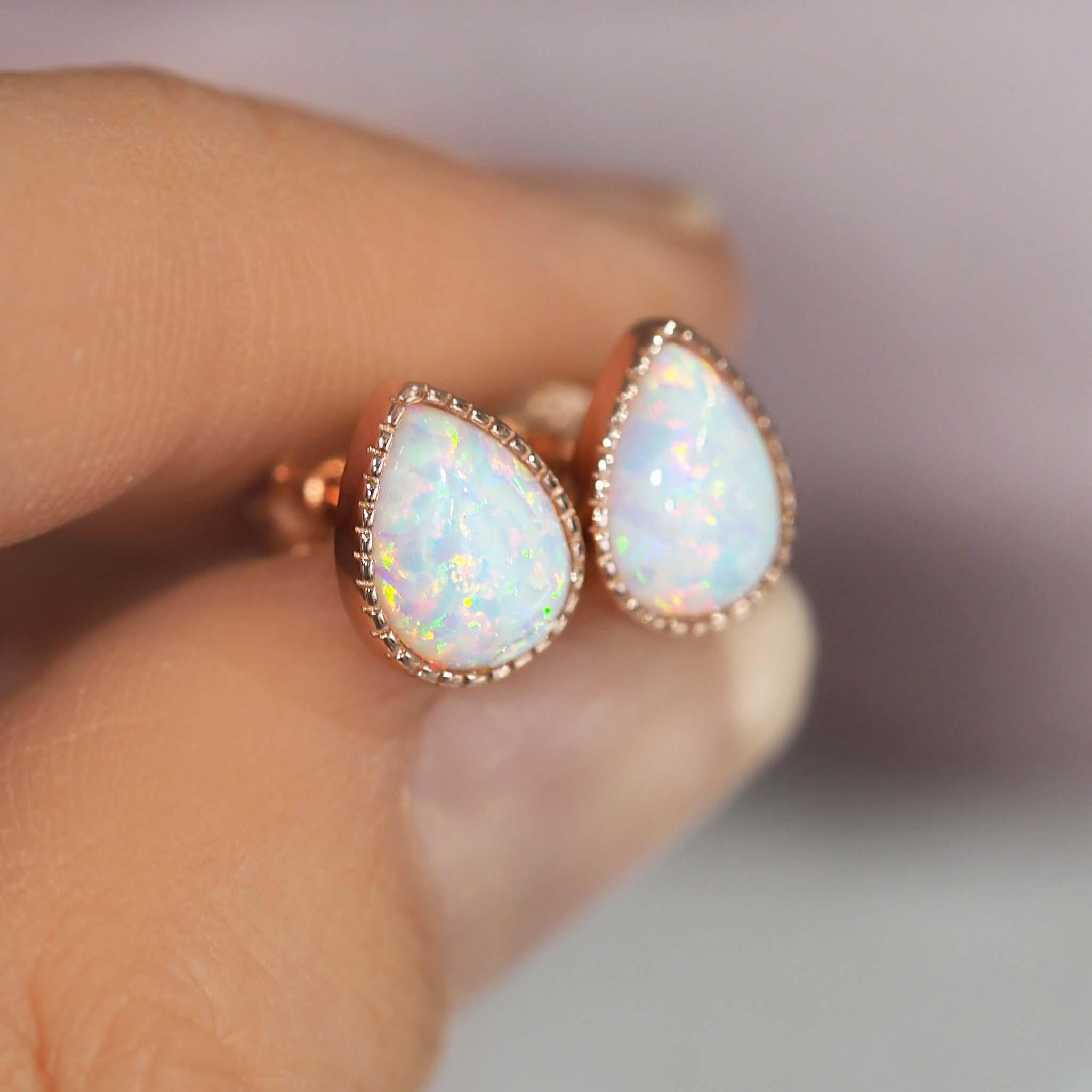 Fingers holding Rose Gold Opal Earrings - womens rose gold opal jewellery by australian jewellery brands indie and harper