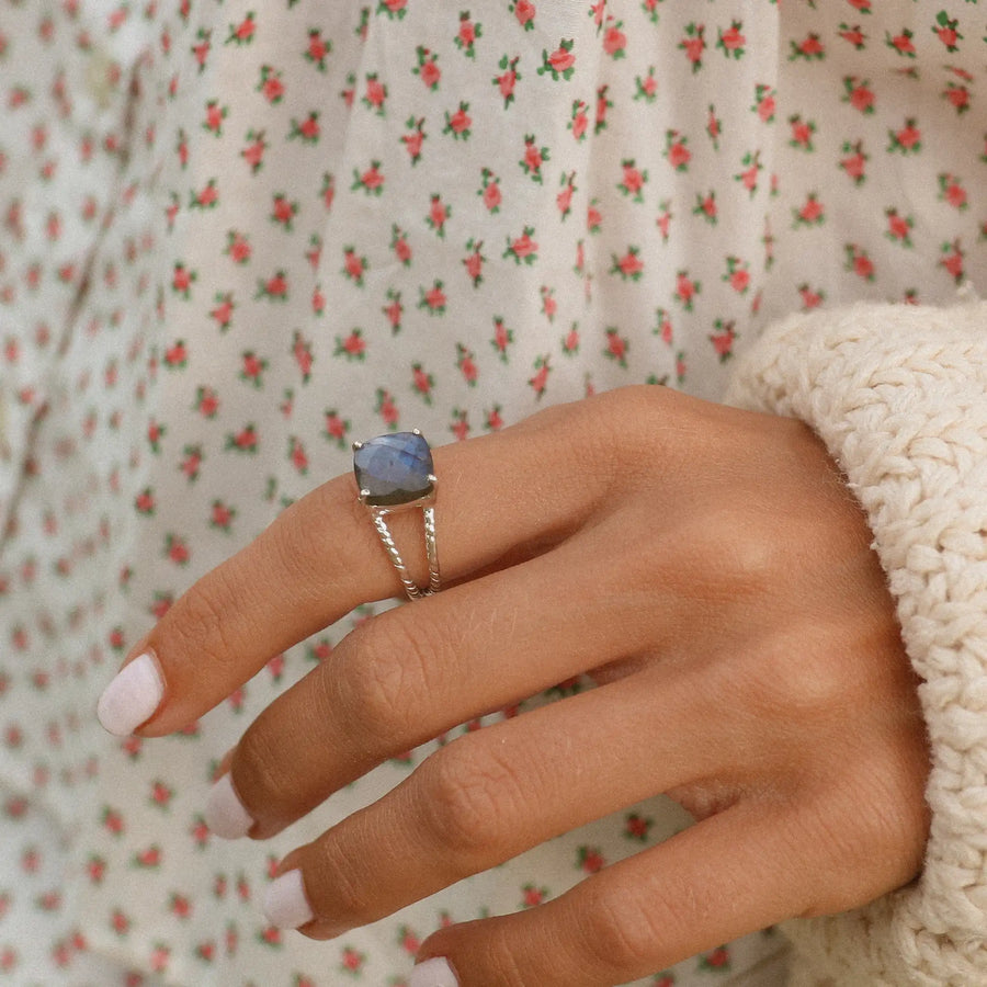 close up of woman's hand wearing sterling silver labradorite ring - labradorite jewellery by australian jewellery brands indie and harper 