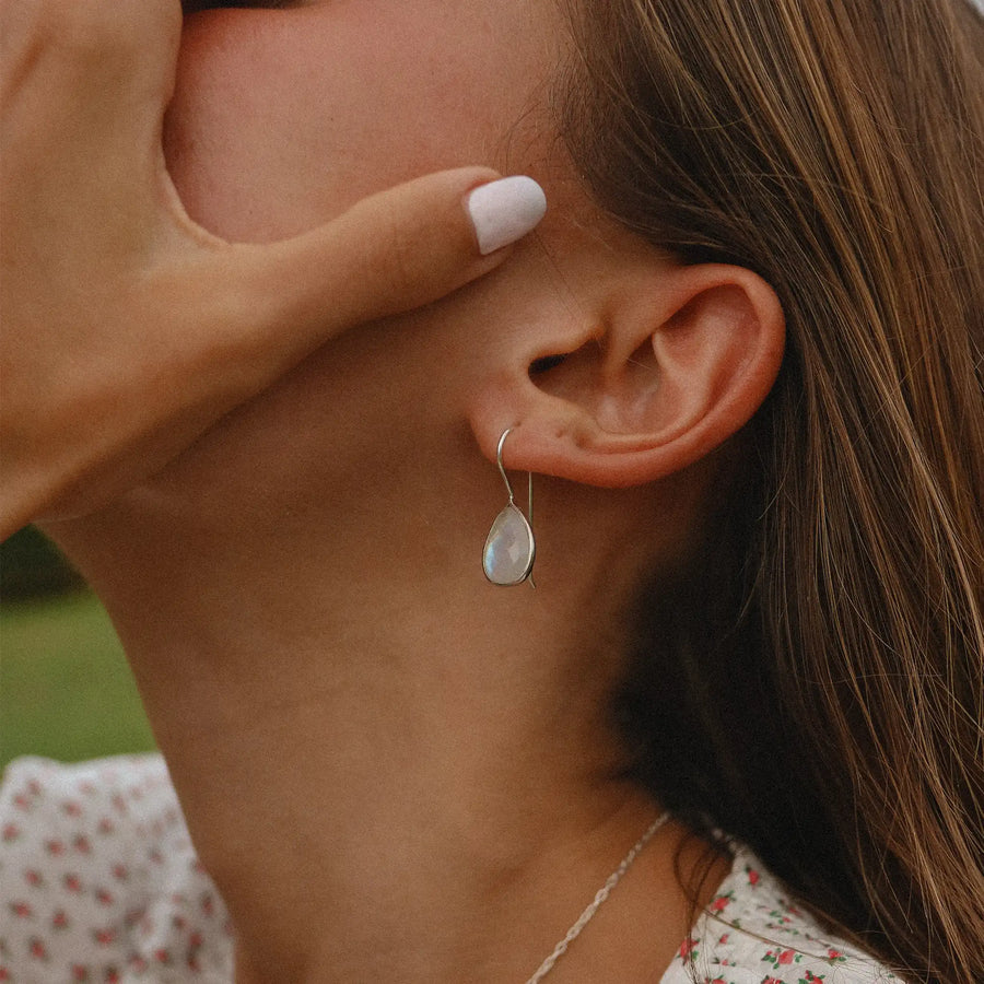 Woman wearing sterling silver moonstone earrings - moonstone jewellery Australia by online jewellery brand indie and Harper 