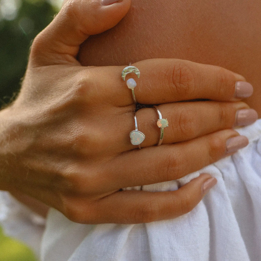 Woman wearing opal rings - opal jewellery by Australian jewellery brands indie and harper