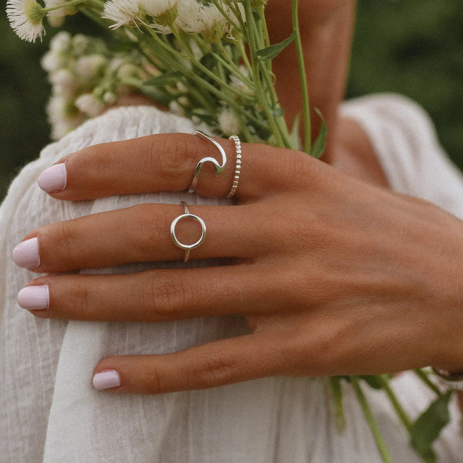 woman wearing three sterling silver rings - womens jewelry by australian jewellery brand indie and Harper 