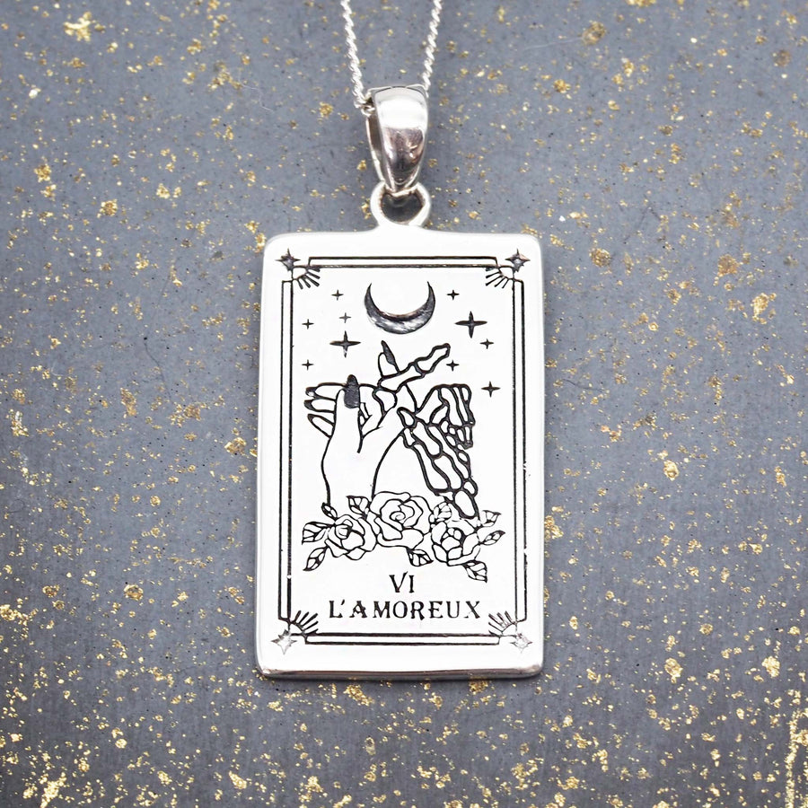 the lovers tarot necklace made with sterling silver - hand drawn the lovers tarot card design by online jewelry brand indie and harper