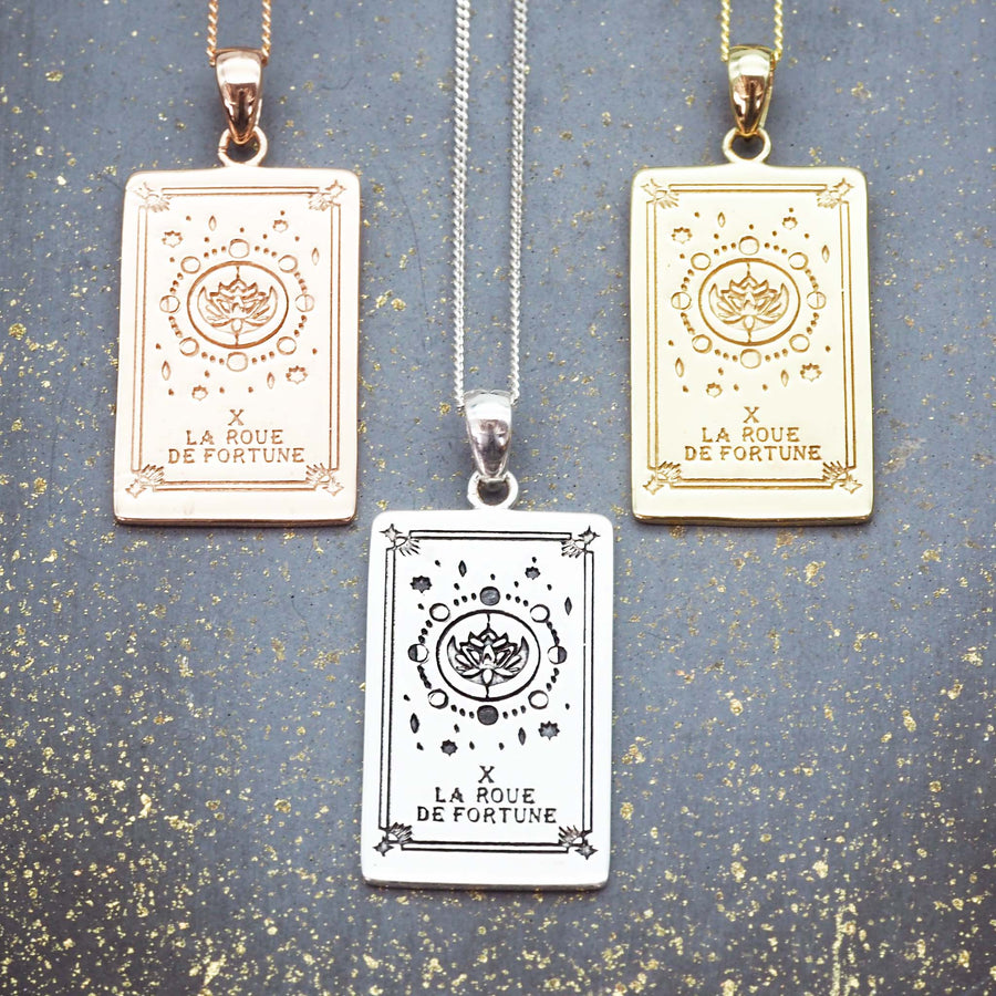 the wheel of fortune tarot card necklace - made with sterling silver and 9k gold and rose gold plating with hand draw design by indie and harper