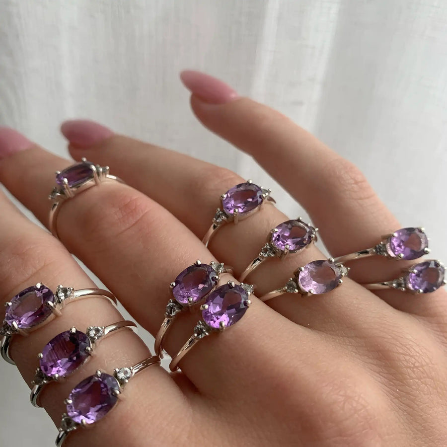 Hand wearing white topaz and pink amethyst rings - white topaz and amethyst jewellery by australian jewellery brands indie and harper