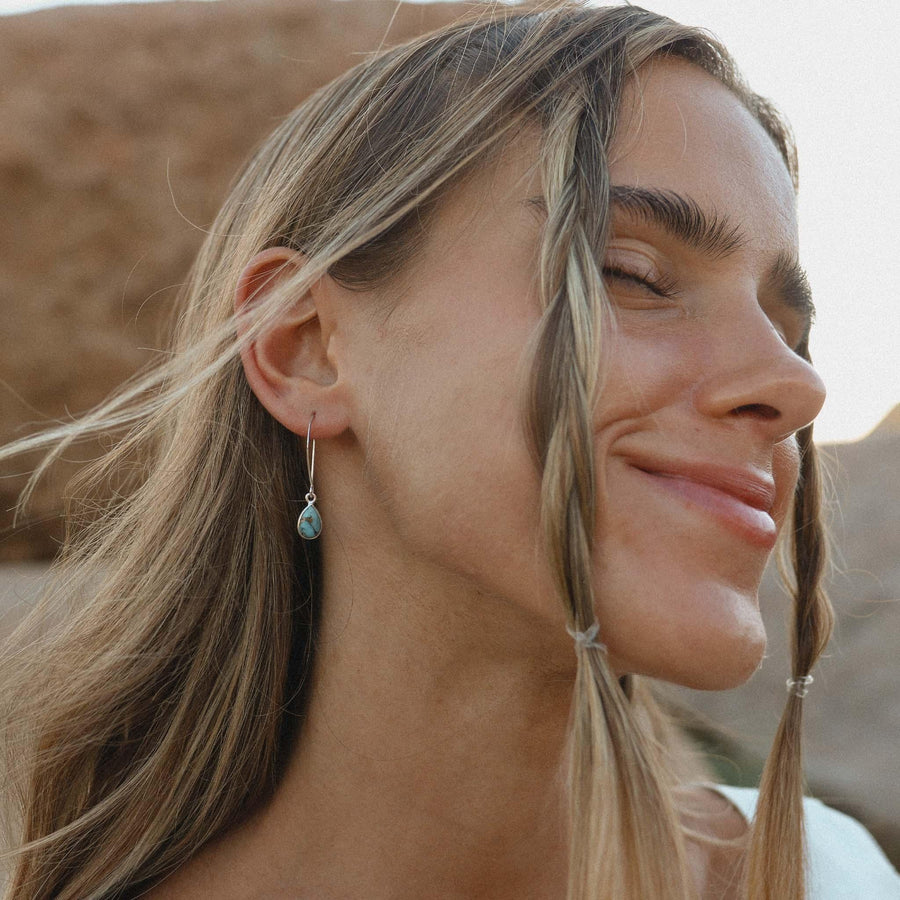 Lady smiling with plaits in her hair wearing Turquoise Earrings - womens turquoise jewellery by australian jewellery brands online indie and harper