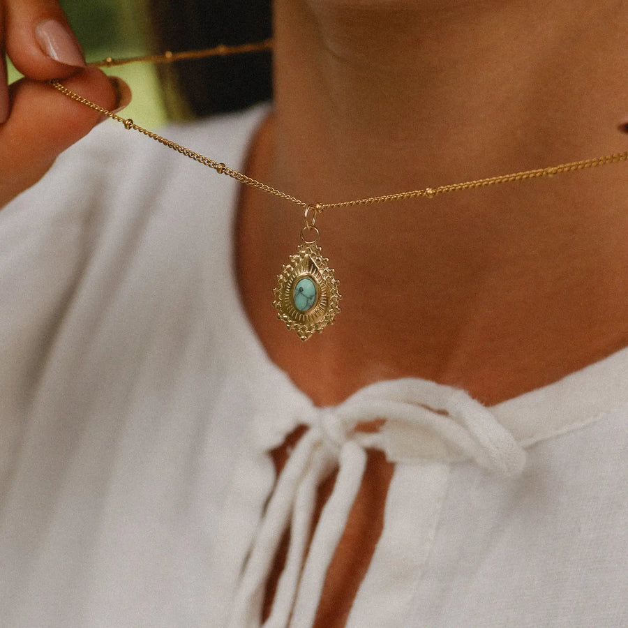 woman wearing gold turquoise necklace - gold gemstone jewellery by australian jewellery brands indie and harper