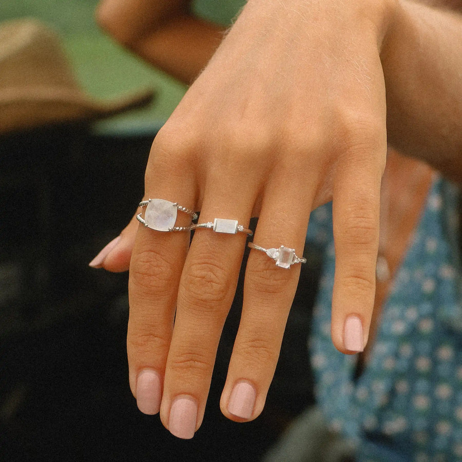 woman wearing sterling silver rings with rainbow moonstones and white topaz stones - womens boho jewellery australia - australia jewellery brand