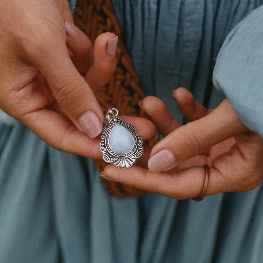 woman holding sterling silver moonstone necklace - moonstone jewellery by australian jewellery brands indie and harper 