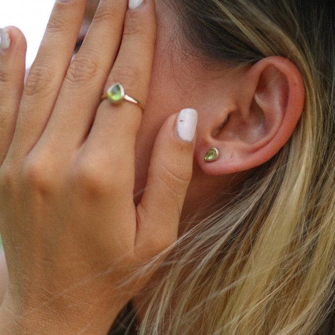 woman wearing august birthstone peridot earrings and ring - womens jewellery by australian jewellery brand indie and harper