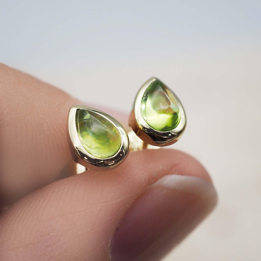 fingers holding August Birthstone peridot Earrings - Gold Earrings by australian jewellery brand indie and harper