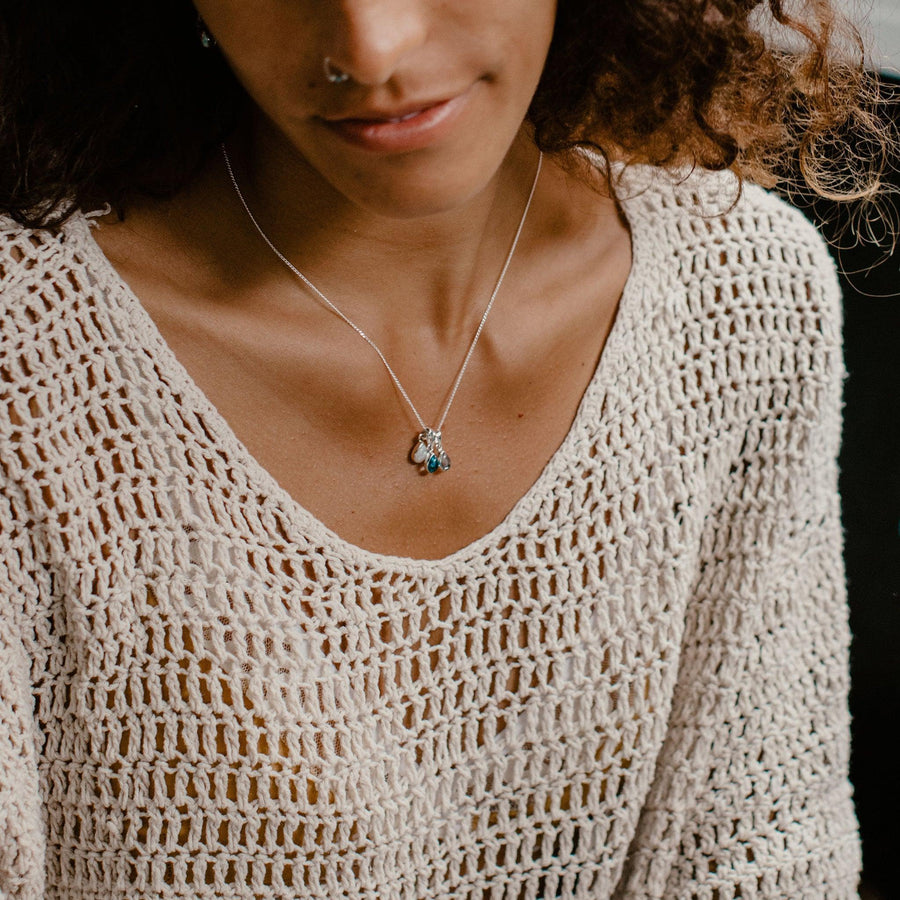 Woman wearing multiple birthstone pendants on a sterling silver chain necklace - womens jewellery by australian jewellery brands indie and harper