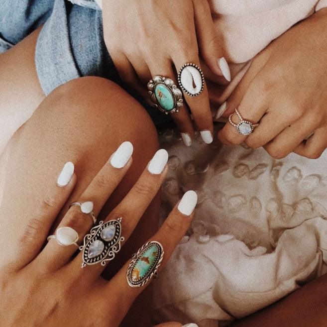 Hands wearing boho rings - boho jewellery by australian jewellery brands online indie and harper