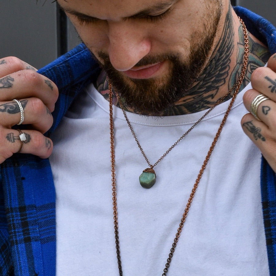 Tattooed man wearing Copper and Raw Emerald Necklace - unisex emerald jewellery by australian jewellery brands indie and harper 