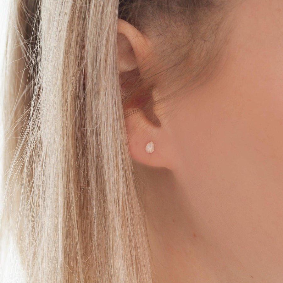 Woman wearing Dainty droplet white Opal Earrings - womens opal jewellery by australian jewellery brands indie and Harper