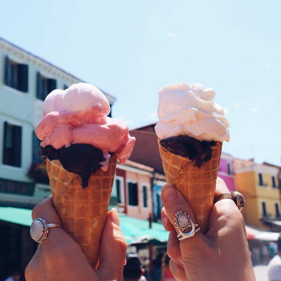 Hands holding ice creams and wearing moonstone rings - moonstone jewellery by australian jewellery brand indie and harper