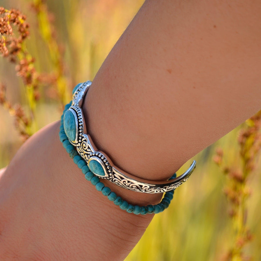 Woman wearing turquoise cuff and turquoise beaded Bracelet - turquoise jewellery by australian jewellery brands indie and Harper 