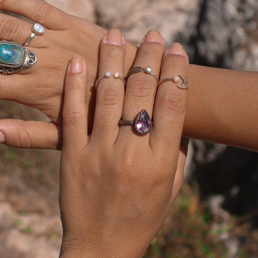 hand wearing copper and amethyst ring - amethyst jewellery by women’s boho jewellery brand indie and Harper