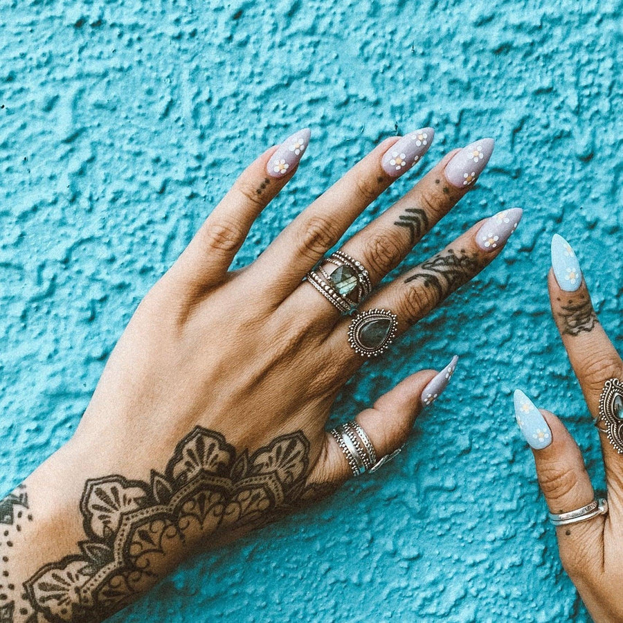 Woman’s hand with tattoos wearing Labradorite Rings - boho jewellery by australian jewellery brands indie and harper