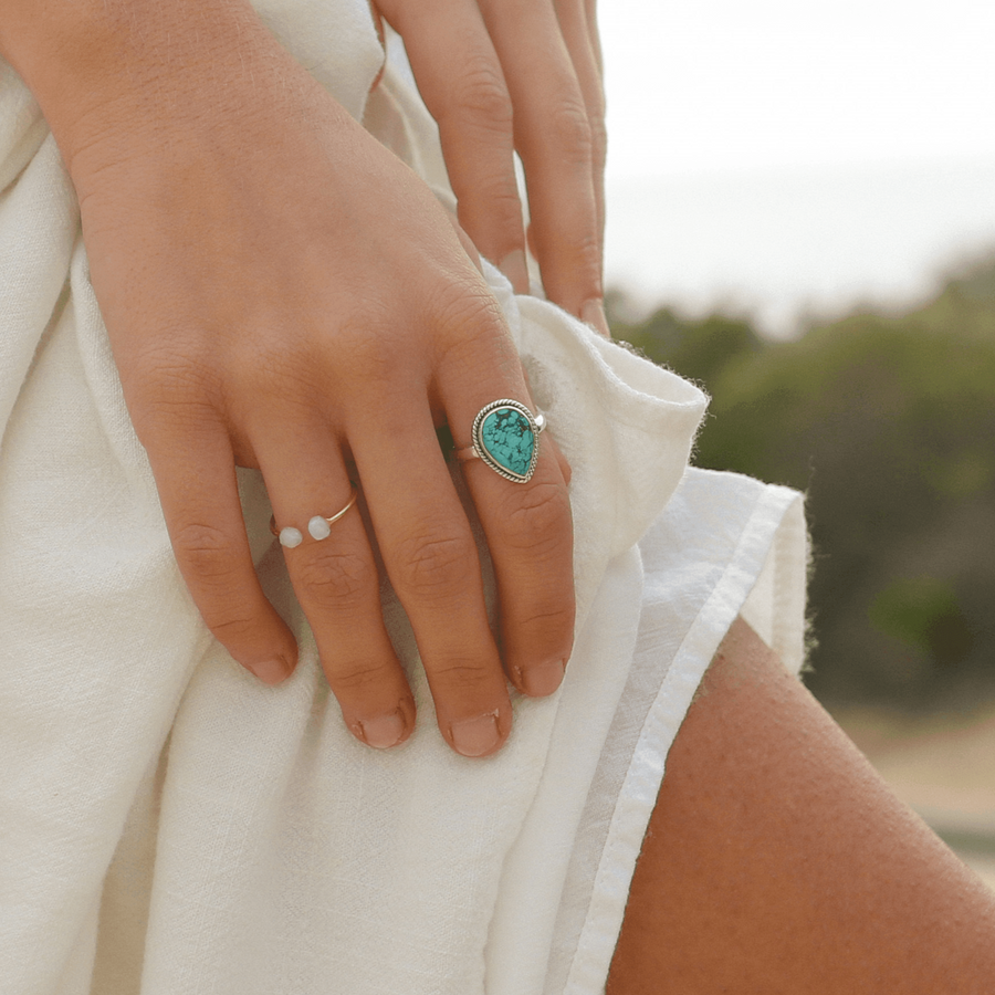 Woman wearing a white dress and silver Turquoise Ring - turquoise jewellery by Australian jewellery brands online indie and harper