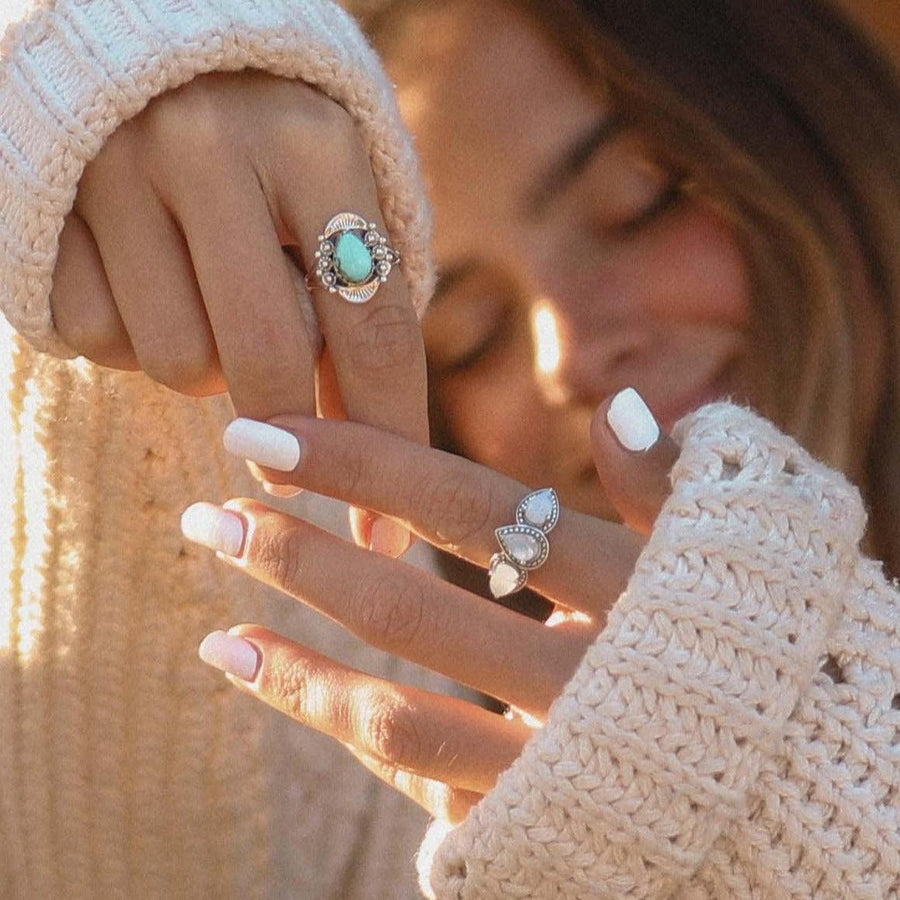 Woman wearing Sterling silver turquoise ring and Moonstone Ring - womens boho jewellery by Australian jewellery brands online indie and harper 