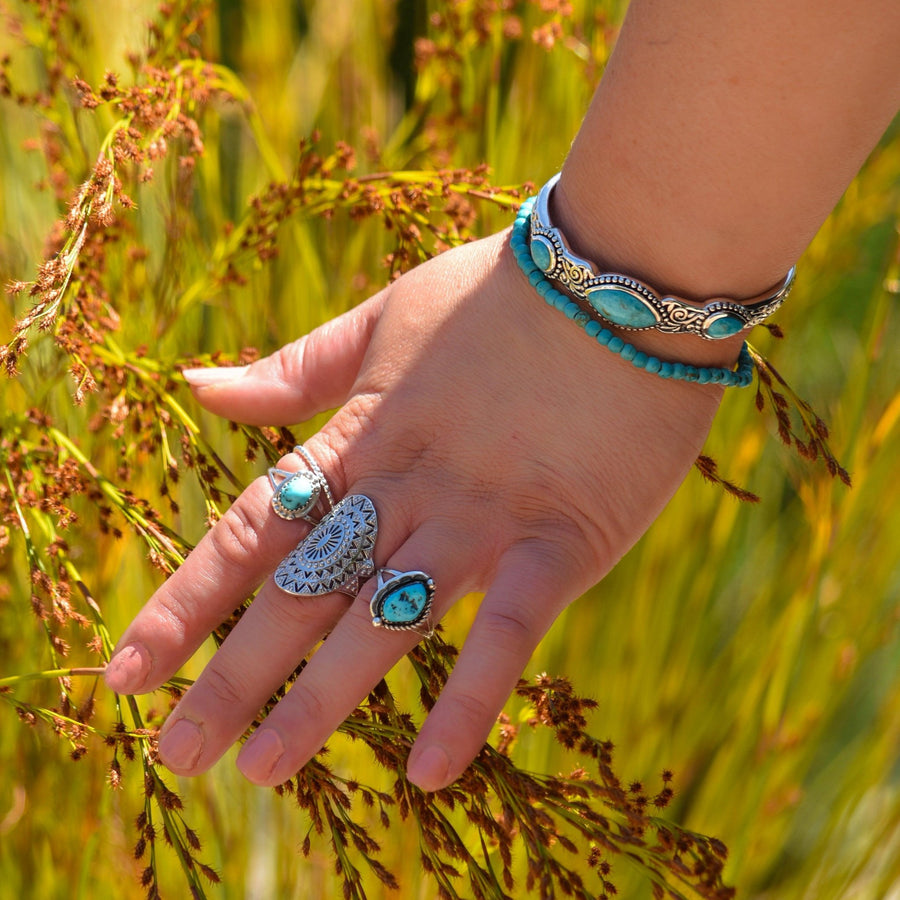 woman wearing sterling silver Turquoise Cuff and turquoise beaded bracelet  - womens turqoise jewellery by boho jewellery brand indie and harper