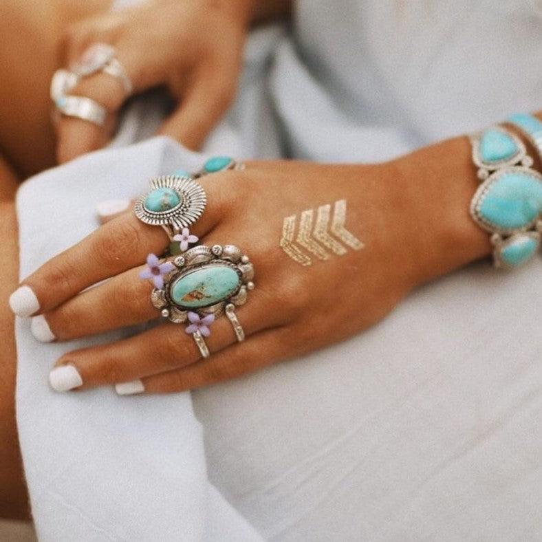 Girl wearing turquoise rings and turquoise bracelet - boho jewellery by women’s jewelry online brand indie and harper